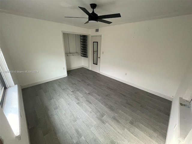 empty room featuring hardwood / wood-style floors and ceiling fan