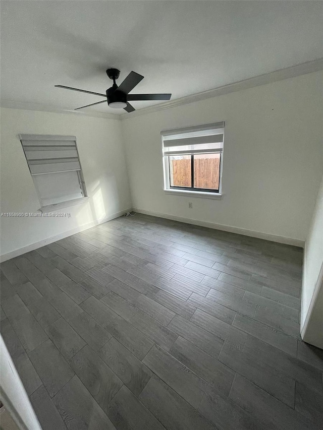 unfurnished bedroom featuring ceiling fan, dark hardwood / wood-style floors, and crown molding