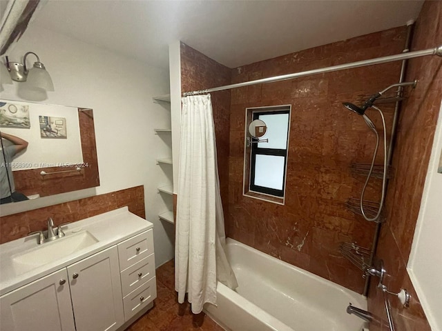 bathroom featuring vanity and shower / bathtub combination with curtain