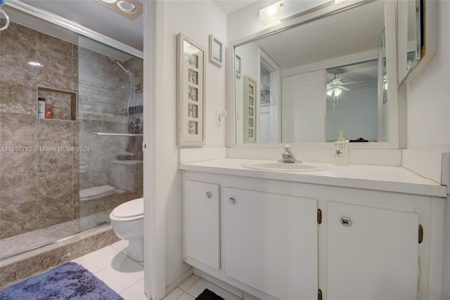 bathroom with vanity, toilet, ceiling fan, and an enclosed shower