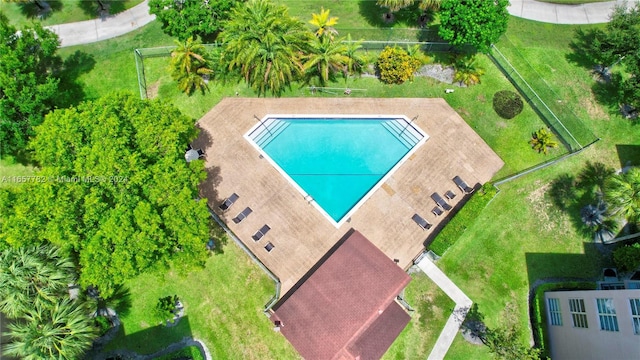 view of swimming pool with a lawn and a patio area