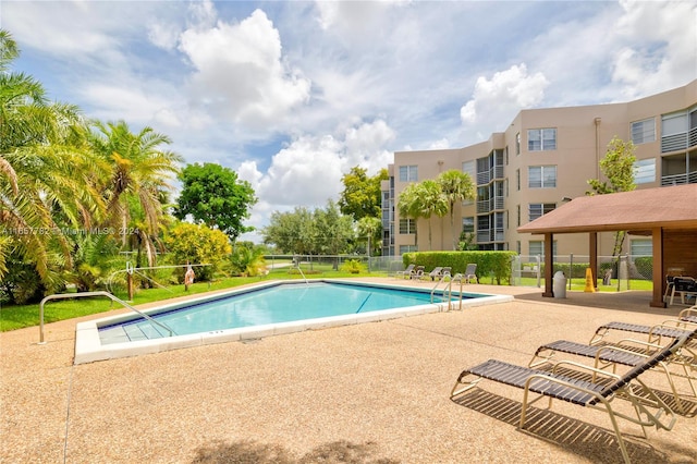 view of swimming pool with a patio area