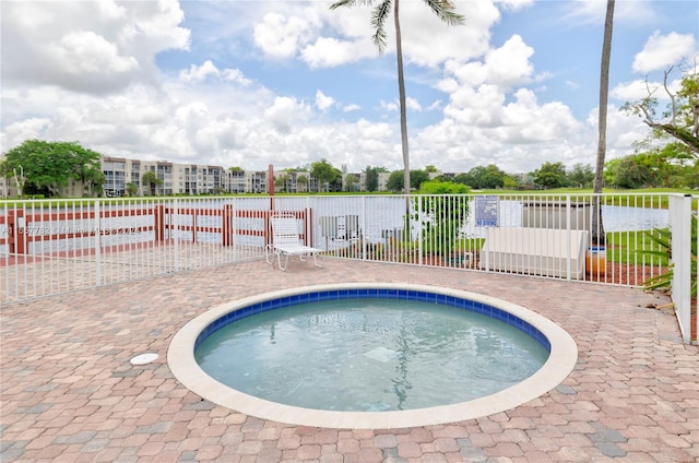 view of pool featuring a hot tub