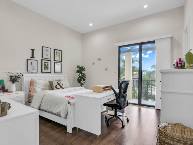 bedroom featuring dark hardwood / wood-style floors and access to exterior