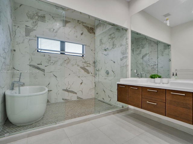 bathroom featuring plus walk in shower, tile walls, tile patterned flooring, and vanity