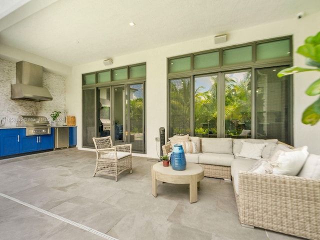 view of patio with area for grilling and exterior kitchen