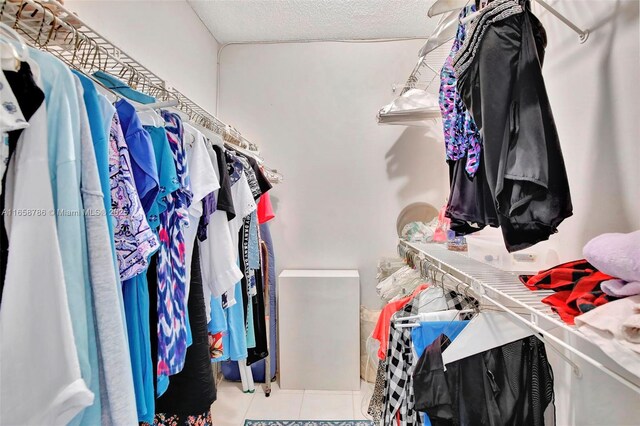 spacious closet featuring tile patterned floors