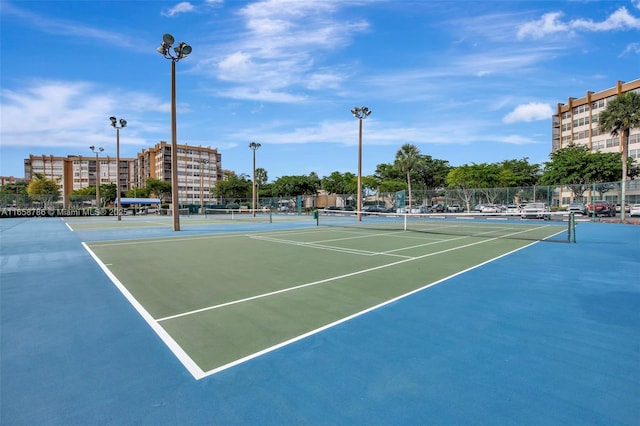 view of sport court featuring community basketball court and fence