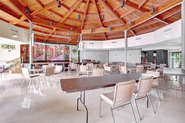 dining space featuring beam ceiling, wood ceiling, visible vents, and tile patterned floors