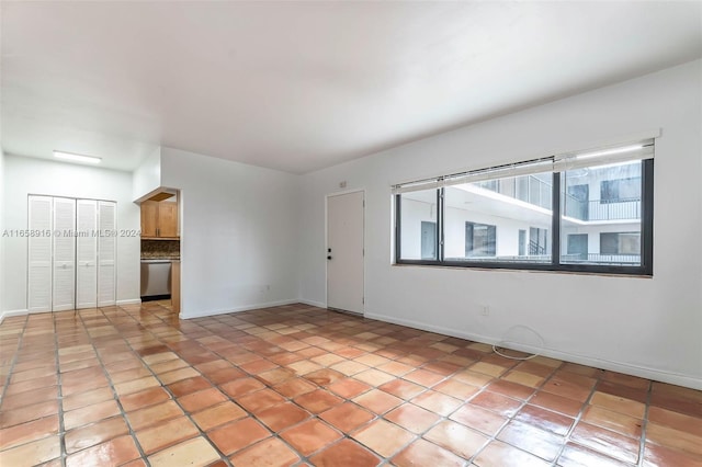 empty room with light tile patterned floors