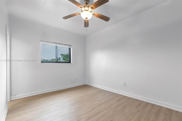 empty room with light hardwood / wood-style flooring and ceiling fan