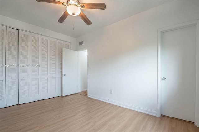 unfurnished bedroom with a closet, ceiling fan, and light hardwood / wood-style flooring