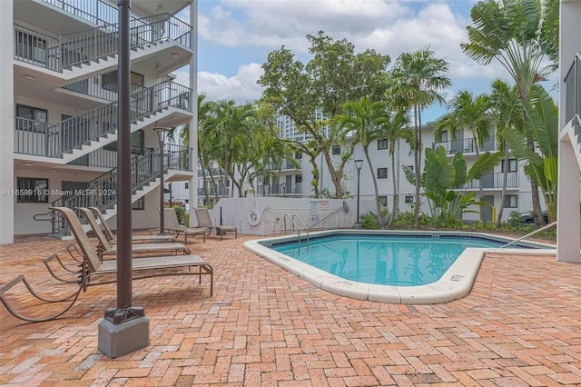 view of swimming pool with a patio area