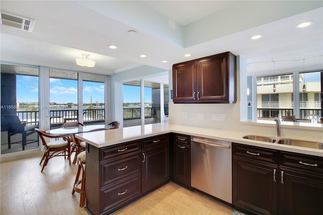 kitchen with appliances with stainless steel finishes, wall chimney range hood, and tasteful backsplash