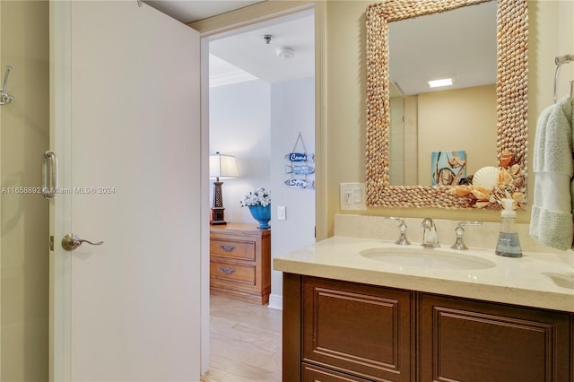 bedroom featuring ceiling fan, a beach view, crown molding, access to exterior, and a water view