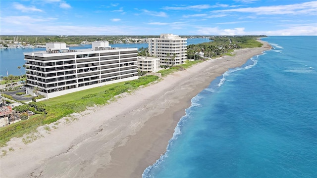 aerial view featuring a view of the beach and a water view