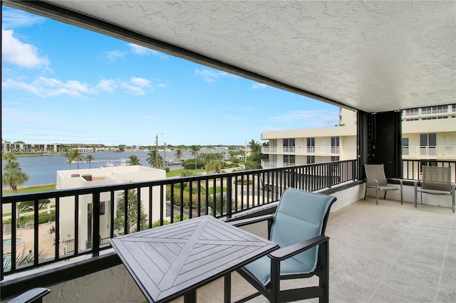 balcony featuring a water view