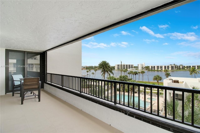 balcony featuring a water view