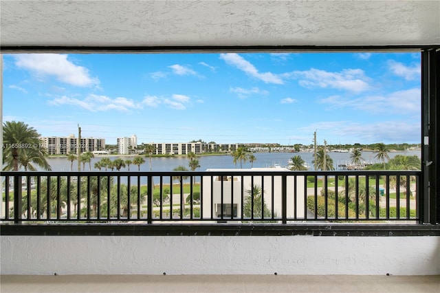 balcony featuring a water view