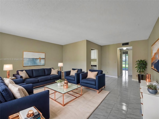 living room with tile patterned floors