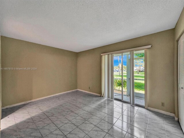 spare room featuring a textured ceiling