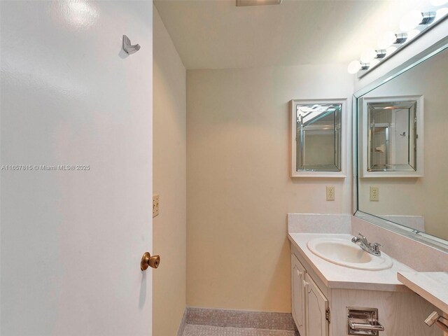 unfurnished bedroom featuring a textured ceiling, access to outside, two closets, and light tile patterned flooring