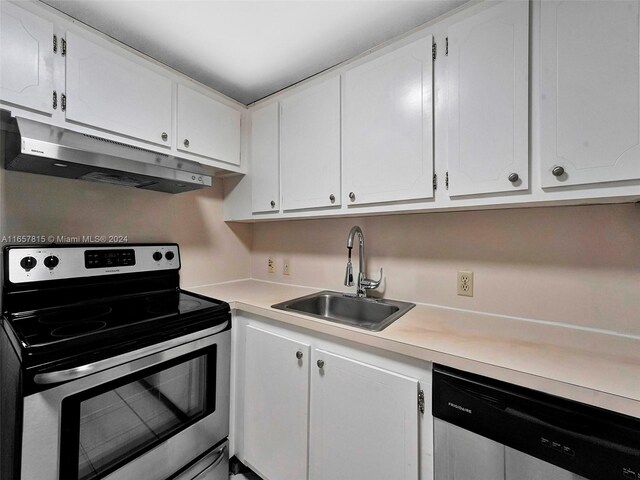 kitchen with sink, appliances with stainless steel finishes, and white cabinetry