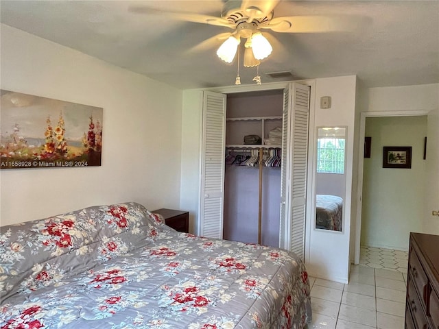 bedroom with ceiling fan and light tile patterned floors