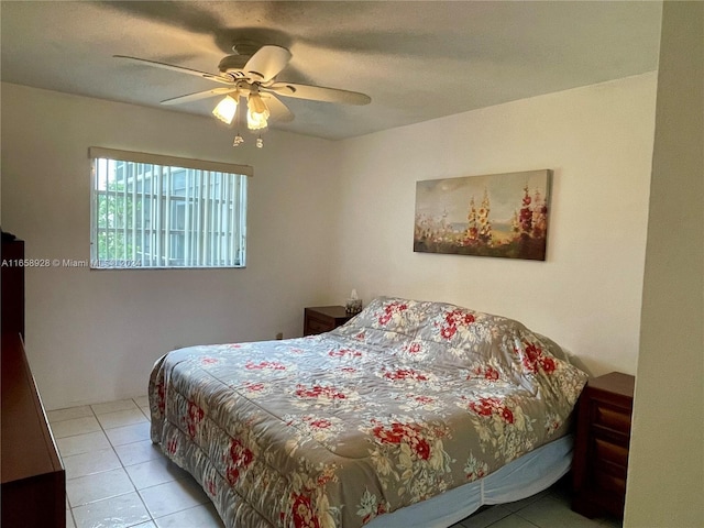 bedroom with light tile patterned floors and ceiling fan