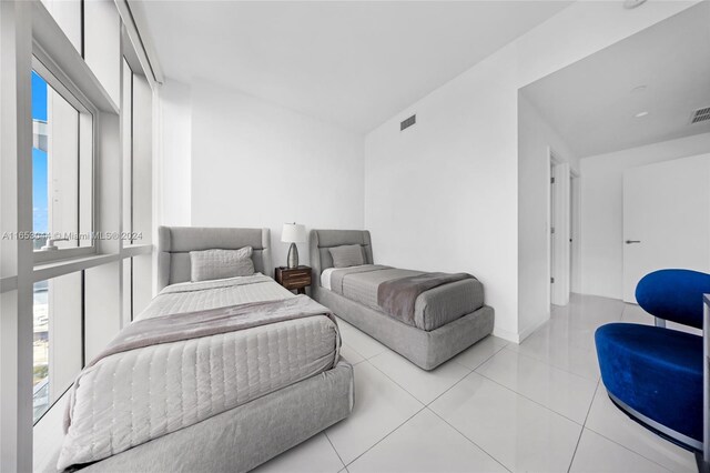 bedroom with light tile patterned flooring