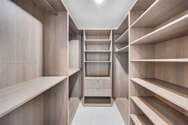 walk in closet featuring light tile patterned floors