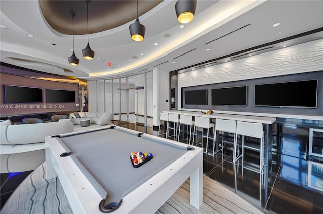 recreation room featuring a raised ceiling and billiards