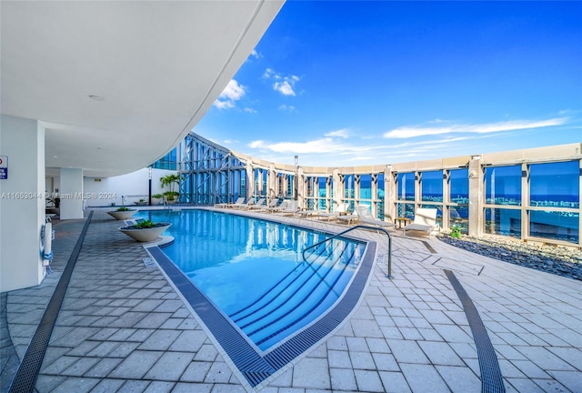 view of pool featuring a patio