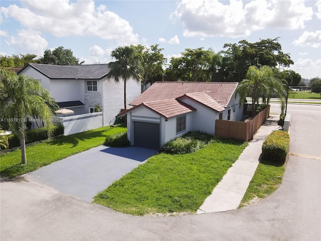 view of home's exterior featuring a yard and a garage