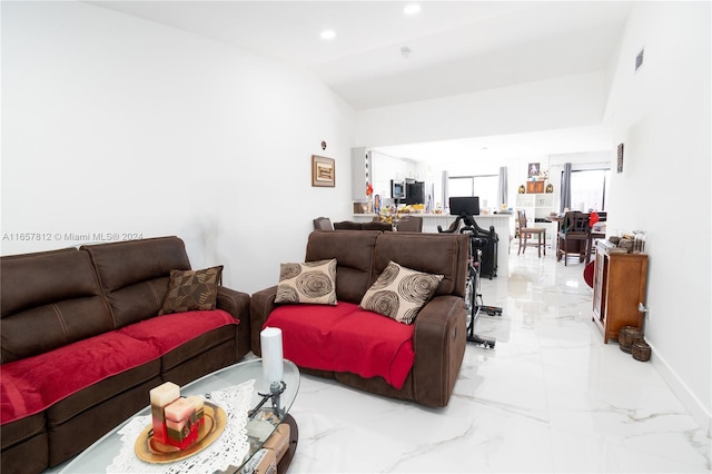 living room with lofted ceiling