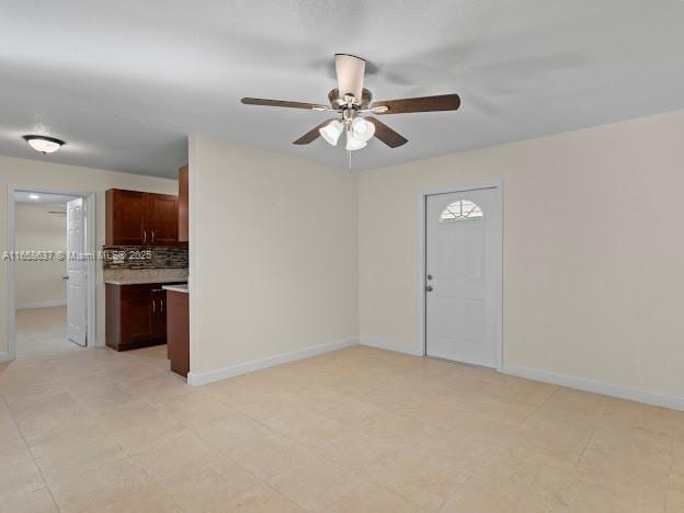 spare room with ceiling fan