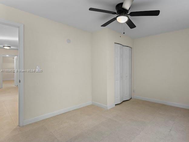 empty room featuring ceiling fan