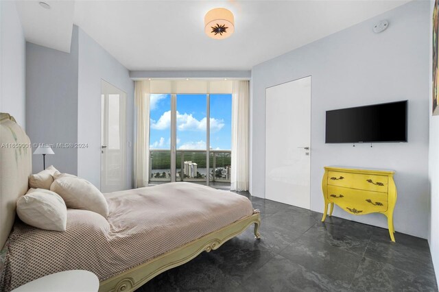 bedroom featuring floor to ceiling windows