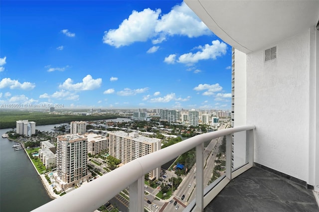 balcony featuring a water view