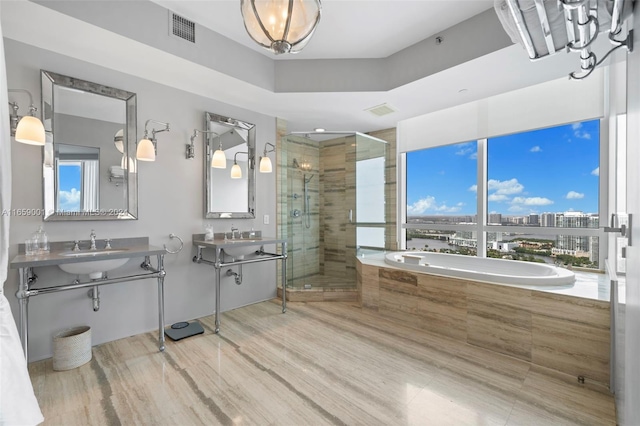 bathroom featuring plus walk in shower, hardwood / wood-style floors, and vanity