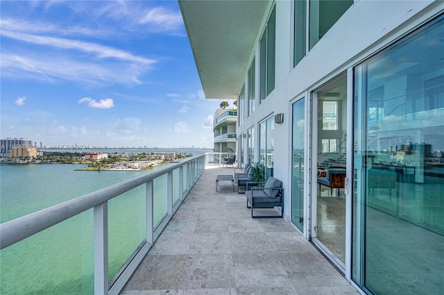 balcony featuring a water view