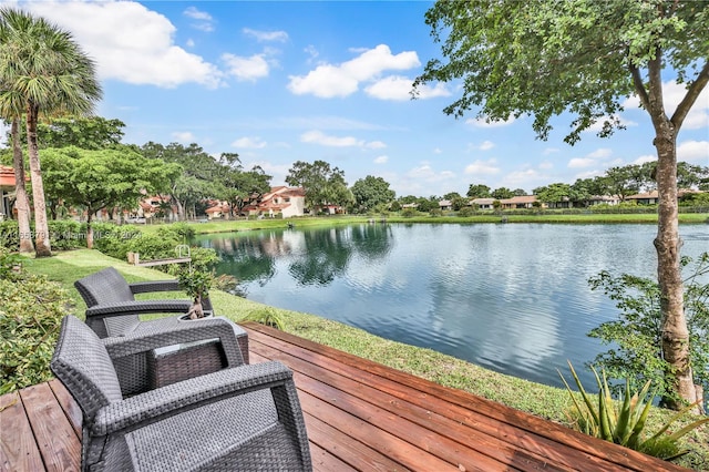 wooden deck featuring a water view