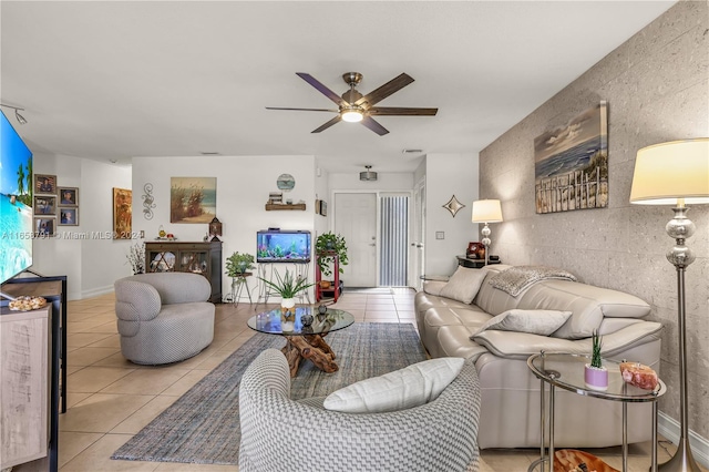 tiled living room featuring ceiling fan