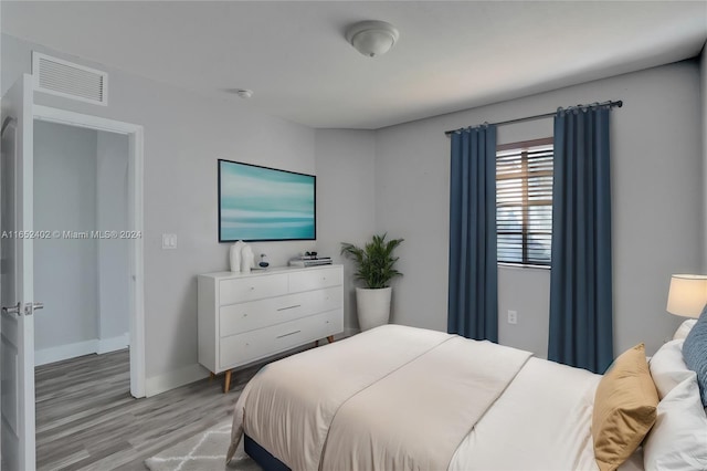 bedroom featuring light hardwood / wood-style floors