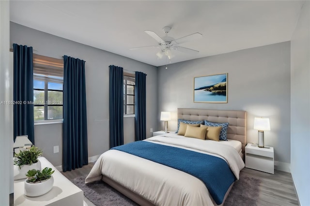 bedroom featuring ceiling fan and wood-type flooring