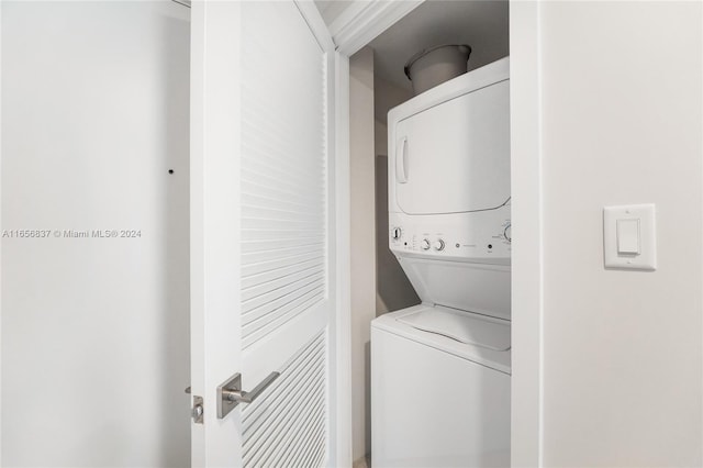 washroom with stacked washer and clothes dryer