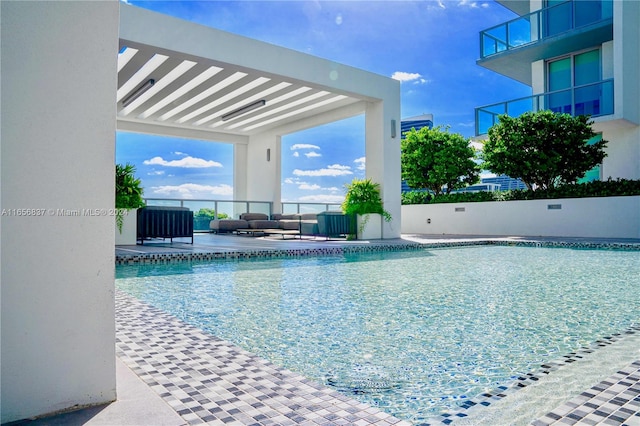 view of pool featuring a patio