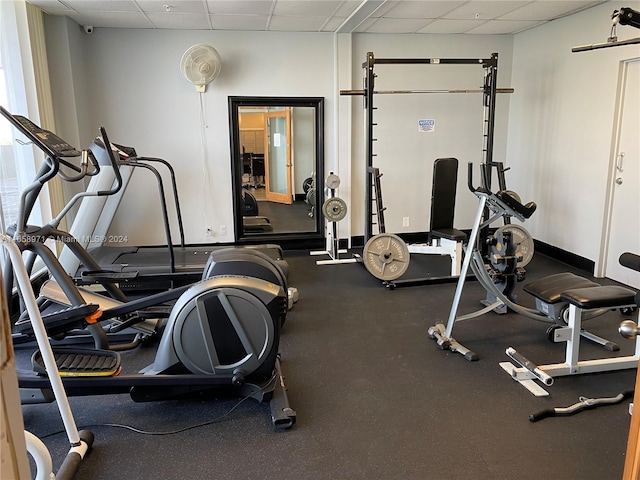 workout area featuring a paneled ceiling