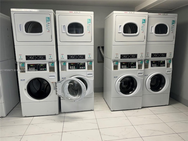 laundry room featuring washer and clothes dryer and stacked washing maching and dryer