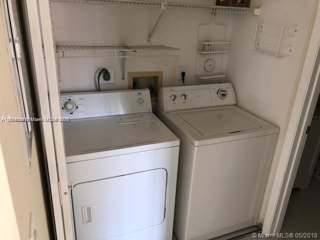 clothes washing area featuring washing machine and clothes dryer